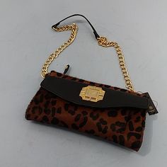 Monet Leather Clutch Removable Chain Strap Leopard Print Black/Brown. Measures Approximately 6" High X 9.5" Wide. 3-Pocket Organizer On The Front And One Large Slide Pocket On The Back. Top Zipper Closure. One Zippered Pocket Inside. Chain Strap Drop Is About 14". New With Tags. Chic Brown Clutch With Chain Strap, Brown Chain Clutch Shoulder Bag, Brown Crossbody Clutch With Chain Strap, Evening Brown Shoulder Bag With Chain Detail, Evening Brown Shoulder Bag With Chain, Brown Party Clutch With Chain Strap, Formal Brown Bag With Chain Detail, Formal Brown Bags With Chain Detail, Formal Brown Bag With Chain