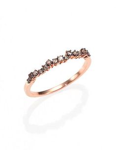 a rose gold ring with brown diamonds