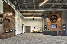 the inside of an office building with wood paneling