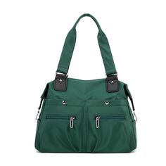 a green handbag with two zippers on the front and side pockets, one is open