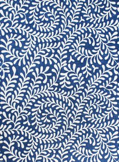 a blue and white pattern with leaves on it