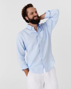 The PERUGIA men's shirt in sky blue is a staple for warm weather, designed for both style and comfort. Crafted with a modern fit and made exceptionally soft through a unique wash process, this shirt provides everyday wearability. It features long sleeves with buttoned cuffs and a pleated back yoke to ensure a relaxed fit. A practical chest pocket adds functionality, complemented by white river shell buttons that enhance the front and collar. Details: * Regular fit  * Buttoned  * Long sleeves wit Classic Light Blue Summer Shirt, Light Blue Shirt With Relaxed Fit And Spread Collar, Blue Relaxed Fit Dress Shirt For Spring, Casual Light Blue Dress Shirt For Summer, Classic Light Wash Shirt For Summer, Classic Light Wash Summer Shirt, Light Blue Dress Shirt With Spread Collar For Summer, Casual Light Blue Linen Shirt, Summer Light Blue Cotton Dress Shirt