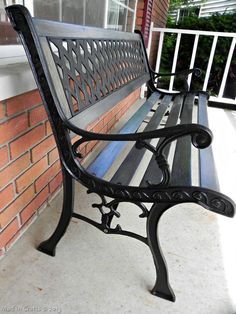 a bench sitting on the side of a building