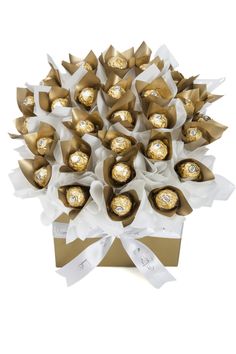 a bouquet of chocolates wrapped in white ribbon