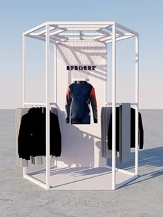 an open white display case with clothes on hangers in front of it and the words byborrt written across the top