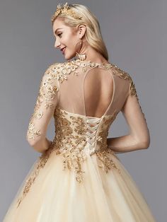 the back of a woman's dress with gold flowers on it