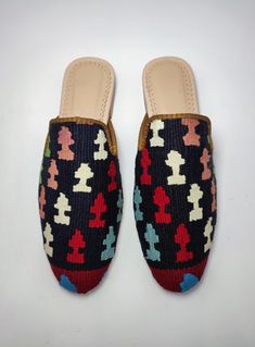 Welcome to AliDesignStore This Kilim Mules one -of-A-kind! Upper Made of a Hand-Selected Vintage Turkish Kilim Rug . Kilims Rugs Are Hand Crafted From Vegetable Yarn. Have Stronger weave. - Handcrafted - Materials : Handwoven Kilim Rug Leather Sole Leather Trimmed Leather Lining Stacked Leather Sole Rubber Under The Stacked Heel Care: Soft Clothing Brush İs Recommended To Clean The Slipper. İf Something Spill on it.You Can Clean İt a Cloth With shampoo. - Ships from a small business in Turkey Handmade Casual Mules, Casual Multicolor Mules With Rubber Sole, Casual Multicolor Closed Toe Mules, Multicolor Mules With Rubber Sole And Round Toe, Multicolor Closed Toe Mules With Removable Insole, Casual Handwoven Closed Toe Mules, Artisan Handmade Slip-on Mules, Casual Handwoven Slip-on Mules, Designer Slip-on Mules With Closed Toe