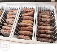 the freezer is full of frozen meats and wrapped in plastic bags for storage