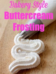 a close up of food on a wooden surface with text overlay that reads bakery style buttercream frosting