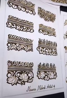 some gold and white paper with designs on it