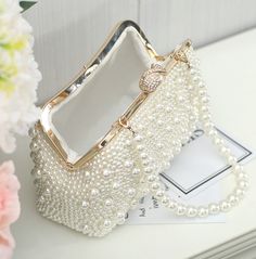 Luxury Pearl Clutch For Party, Gold Pearl Evening Bag For Events, White Evening Bag With Pearl Embroidery For Party, Elegant White Evening Bag, Party Gold Pearl Clutch, Chic Pearl Clutch For Party, Formal Gold Clutch With Pearl Material, Luxury Pearl Embroidered Evening Bag For Party, Gold Pearl Clutch For Parties