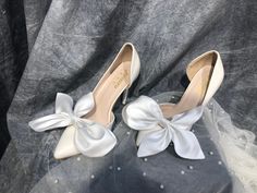 "Wedding Shoe Lace Charms, Silk Shoe Clips, Wedding Shoe Accessories, White Wedding Shoes Bows Clip A beautiful pair of bows made of high quality silk. I will make these bows for you in a neat and delicate way. You will get 99% same bows as the photo. These bows you can attach to your wedding shoes at the front, back, next to the ankle. You can also use them as an accessory to your handbag. They are very flexible for your ideas. Corlor: White, Ivory, Black, Beige,... 𝗗𝗲𝗹𝗶𝘃𝗲𝗿𝘆:  US, UK, CA, EU 10-15 business days Every where: 18-24  business days Shipping time is in business days, excluding Saturdays, Sundays and public holidays in our country * Please make sure to leave a note your wedding date and when you want to get the veil in your order. * If you want a paid express shipping s Spring Wedding Satin Heels, Satin Closed-toe Wedding Shoes, Elegant Satin Wedding Shoes, Summer Wedding Satin Shoes, Closed Toe Satin Heels For Wedding, Satin Closed Toe Heels For Wedding, Spring Wedding Heels With Satin Bow, Satin Closed Toe Wedding Shoes, Elegant White Satin Wedding Shoes