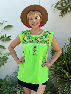 "Neon green Mexican blouse women, floral hand embroidery, fiesta mexicana outfit, Chartreuse top, boho hippie, cottagecore aesthetic, puebla  Elevate your fashion game with our striking Neon Green Mexican Blouse for women, a radiant fusion of tradition and contemporary style. This blouse is not just clothing; it's a vibrant cultural statement that will make you the life of any fiesta Mexicana. Adorned with intricate hand-embroidered floral patterns, this chartreuse top is a testament to the skilled artisans of Puebla. Each stitch is a work of art, preserving the rich heritage of Mexican craftsmanship. The neon green hue adds a pop of color, making it a standout piece in any setting. Whether you're embracing the boho hippie spirit, cultivating a cottagecore aesthetic, or simply looking for Green Cotton Festival Blouse, Traditional Green Blouse For Spring, Summer Fiesta Blouse With Floral Embroidery, Summer Fiesta Floral Embroidered Blouse, Green Traditional Embroidered Top For Spring, Summer Fiesta Floral Embroidery Blouse, Traditional Green Embroidered Top For Spring, Multicolor Embroidered Summer Tops For Fiesta, Green Embroidered Festival Tops