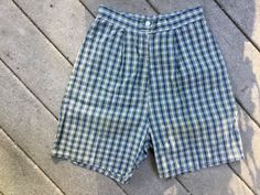 "Cute pair of shorts! They are a mini plaid done in blue, green and white. Zipper close with button at waist and. 2 short pleats on the front. Little pocket and buckle on back. Measurements: 25\" waist; 37\" hips; waist to crotch is 14 1/2\"; 18\" tall; 21\" leg opening Thanks for stopping by my Etsy store!" Gingham Shorts For Spring Daywear, Spring Gingham Shorts For Daywear, Gingham Cotton Shorts For Daywear, Plaid Cotton Shorts For Daywear, Green Retro Cotton Shorts, Gingham Shorts With Pockets, Plaid Beach Shorts, Plaid Cotton Beach Shorts, Blue Plaid Shorts