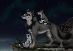 two wolfs sitting on top of each other in the night