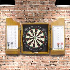 a brick wall with two darts in the center and three score boards on each side