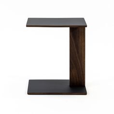 a wooden table with a black base on the top and one leg in the shape of a rectangle