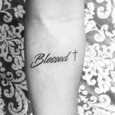 a black and white photo of a person's foot with the word, blessed on it