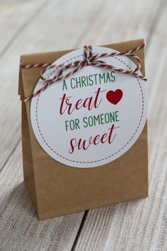 a brown paper bag with a christmas treat for someone sweet on it