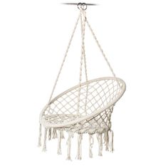 a white hanging hammock with tassels