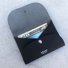 a wallet with money sticking out of it