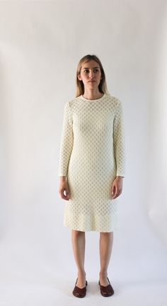 "DETAILS ◦ Vintage 1960s knit shift dress ◦ Cream color ◦ Round neckline ◦ Fitted bodice and skirt ◦ Long sleeves ◦ Center back zipper Please note: you will need a slip underneath! Slip not included. No Label Estimated Size | Small Measurements | NOT stretched (fabric has stretch) Bust - 35\" Waist - 30\" Hips - 34\" Sleeves - 21\" Length - 38\" Shoulders - 14\" Tag/Label | None, only a small tag with \"10\" on it. Material | Unknown, feels like polyester acrylic blend? Fabric is heavy; fabric h Retro Beige Long Sleeve Dress, Cream Fitted Long Sleeve Vintage Dress, Fitted Textured Knit Midi Dress, Fitted Knee-length Textured Knit Dress, Cream Long Sleeve Retro Vintage Dress, Elegant White Textured Knit Dress, White Textured Knit Fitted Dress, White Textured Knit Fitted Sweater Dress, Retro Vintage Cream Dress With Lace Trim