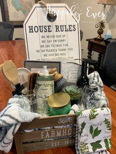 a wooden crate filled with lots of items on top of a table next to a sign