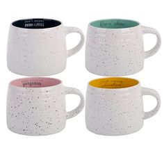 four coffee mugs with different colors and speckles are shown in this image