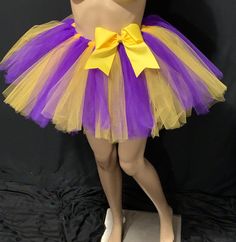 You are going to fall in love with this Beautiful purple and yellow stripe extra full tutus , it is Handmade from 100% Polyester materials Soft Comfortable 1 inch satin covered Elastic. Comes with a beautiful Matching purple or yellow color bow, it is Lightweight and fun to wear. The same length is available in other colors as well at no additional cost, however it would be considered custom made. Please leave me a note in the message box your color preferences at the completion of your purchase Fitted Yellow Tutu Dress With Tulle Skirt, Yellow Tutu, Diy Fails, Columbus Ga, Tulle Tutu Skirt, Door Wreaths Fall, Fall Decorations Porch, Purple And Yellow, Message Box