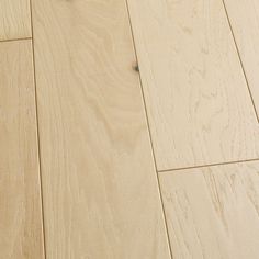 a cat laying on top of a wooden floor