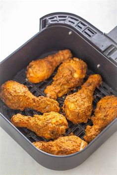 some fried chicken on a grill in a pan with the words, how to make air fry chicken