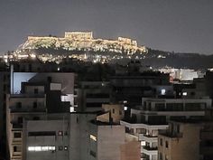 the acrobatic hill in the distance is lit up at night with lights on