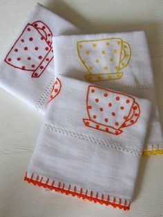 three tea towels with coffee cups on them