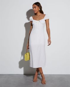 An exceptional choice for brides-to-be, the Bridal Bliss Sweetheart Midi Dress features clean lines in a classic, A-line fit. This midi dress has a cute side slit, sweetheart neckline, cap sleeves, and non-functional front tie. Sweetheart neckline Cap sleeves Side slit Midi length Side zipper closure Self: 55% Linen 45% Rayon, Lining: 100% Rayon Sweetheart Midi Dress, White Tight Dresses, Cottage Dress, Milk Maid, White Short Sleeve Dress, Vici Dress, Spring Break Outfit, Midi Wrap Dress, Ruched Midi Dress