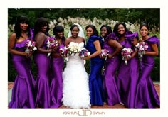 a group of women standing next to each other wearing purple dresses and holding bouquets