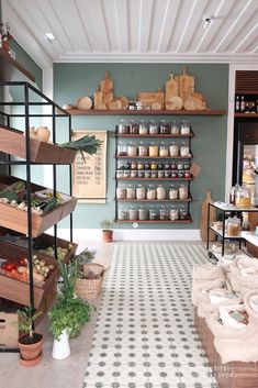 a store filled with lots of different types of food on shelves next to pots and pans