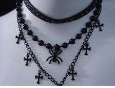 Unleash your inner gothic allure with our Black Gothic Triple Layered Necklace, featuring a striking Spider and Cross Pendant. The necklace showcases a triple-layered chain design, each layer varying in length to create a captivating, tiered effect. The centerpiece is a hauntingly beautiful spider pendant, meticulously crafted with fine details to capture its eerie charm. Complementing the spider is a classic cross pendant, adding a touch of timeless gothic symbolism. Triple Layer Necklace, Steampunk Fashion Male, Tie Necklace, Embroidered Butterfly, Bold Accessories, Steampunk Accessories, Accessories Necklace, Steampunk Fashion, Metal Chain