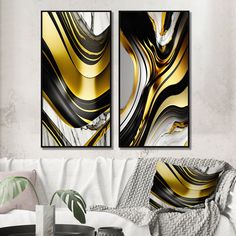 two black and gold paintings in a living room