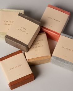 five soap bars stacked on top of each other with the words cedarwood written on them