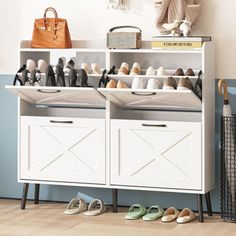 a white cabinet with several pairs of shoes on it