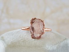 LOTUS - Raw Rose Quartz ring Candid and effortless elegance, delicate and intense at the same time. Symbol of love and beauty, Rose Quartz is the perfect gift for yourself or for your beloved half. DETAILS *Raw AAA grade Rose Quartz *Pure copper base with plating options The ring you will receive will be very similar to the one showed in the photos. Though I do my very best to make them 100% identical, due to the raw nature of the stone and the totally handcrafted working process, each piece wil Elegant Raw Stone Gift Rings, Elegant Raw Stone Rings For Anniversary, Elegant Raw Stone Jewelry For Anniversary, Elegant Raw Stone Wedding Rings, Elegant Wedding Rings With Raw Stone, Elegant Ring With Raw Stone, Delicate Crystal Gemstone Ring For Wedding, Delicate Wedding Crystal Ring With Gemstone, Fine Jewelry Crystal Ring With Si Clarity For Wedding