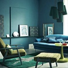 a living room with blue walls and furniture