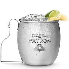 an ice bucket with a lime slice on top and tequila patron written on the side