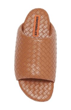 Supple faux-leather strips are woven to form the wide, puffy upper strap of this exceptionally comfortable slide sandal. Textile upper and lining/rubber sole Imported Brown Synthetic Slide Sandals, Brown Synthetic Slides, Synthetic Woven Leather Slide Sandals, Brown Synthetic Slide Mules, Comfortable Brown Woven Leather Sandals, Designer Leather Slides With Textured Footbed, Open Toe Synthetic Slides With Woven Leather, Synthetic Woven Leather Open Toe Slides, Luxury Leather Slides