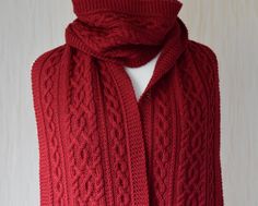 Hand knitted Long Scarf. Aran Wool Scarf in Red colour. Cable Knit motives. Approx. Size: 26 cm x 218 cm (10.2″ x 85.8″) Approx. Weight: 386 g (13.6 oz) This scarf is made of soft and very warm 100% wool yarn. This scarf knitted in a pet free and smoke free studio. Hand wash, max 40oC (104oF). Don't bleach. Don't use fabric softener. Dry Flat. This item is ready to be shipped. I will send you a tracking number when the item is shipped, so you can track your package. If you didn't receive your nu Cable Knit Scarf, Scarf Wool, Red Scarf, Red Scarves, Warm Scarf, Long Scarf, Wool Scarf, Fabric Softener, Knit Scarf