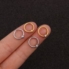 Buying Option: - $14.99 for Single Piece- $19.99 for a Pair (you can choose 2 different earrings)*Comment your option of patterns and color on "Personalization"----------- DESCRIPTIONS ------------ Color: Silver/ Gold - Patterns: Smooth Hoop/ CZ Hoop- Gauge: 16G - 1.2mm- Diameter: 8mm- Stainless Steel Ball: 4mm- Materials: 316L Stainless Steel, 18K Gold Plated, Cubic Zirconia- SKU: HSPJ227- 316L Stainless Steel is hypoallergenic, generally safe for sensitive skin.----------- MIX MATCH PURCHASE - Trendy Round Metal Cartilage Earrings, Trendy Internally Threaded Hoop Earrings For Everyday, Trendy Everyday Internally Threaded Hoop Earrings, Everyday Hypoallergenic Metal Cartilage Earrings, Everyday Hypoallergenic Cartilage Earrings, Minimalist Metal Huggie Cartilage Earrings, Single Round Metal Cartilage Earring, Trendy Hypoallergenic Hoop Cartilage Earrings, Minimalist Metal Piercings For Everyday Wear