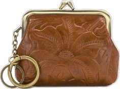 a brown purse with a ring hanging from it's front end and a flower design on the inside