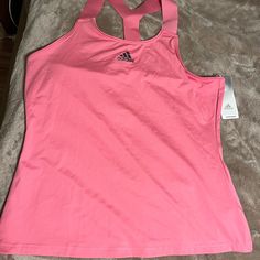 Nwt Adidas Women's Y-Tank Tennis Tank Top Color: Rose Tone/Black Size: Xl The Soft Fabric Stretches With Every Lunge And Slide, Sweat-Wicking Aeroready Means You'll Feel Fresh Through It All. This Product Is Made With Primegreen, A Series Of High-Performance Recycled Materials. 82% Recycled Polyester/18% Elastane Single Jersey Slim Fit Pink Sporty Tank Top For Training, Pink Sports Tank Top With Medium Support, Pink Breathable Sports Tank Top, Pink Sports Tank Top With Built-in Bra, Pink Compressive Sports Tank Top, Tennis Tank Tops, Pink Adidas, Athletic Outfits, Tank Top