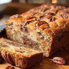 a loaf of pecan bread on a cutting board