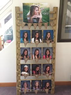 a wooden photo display with pictures on it